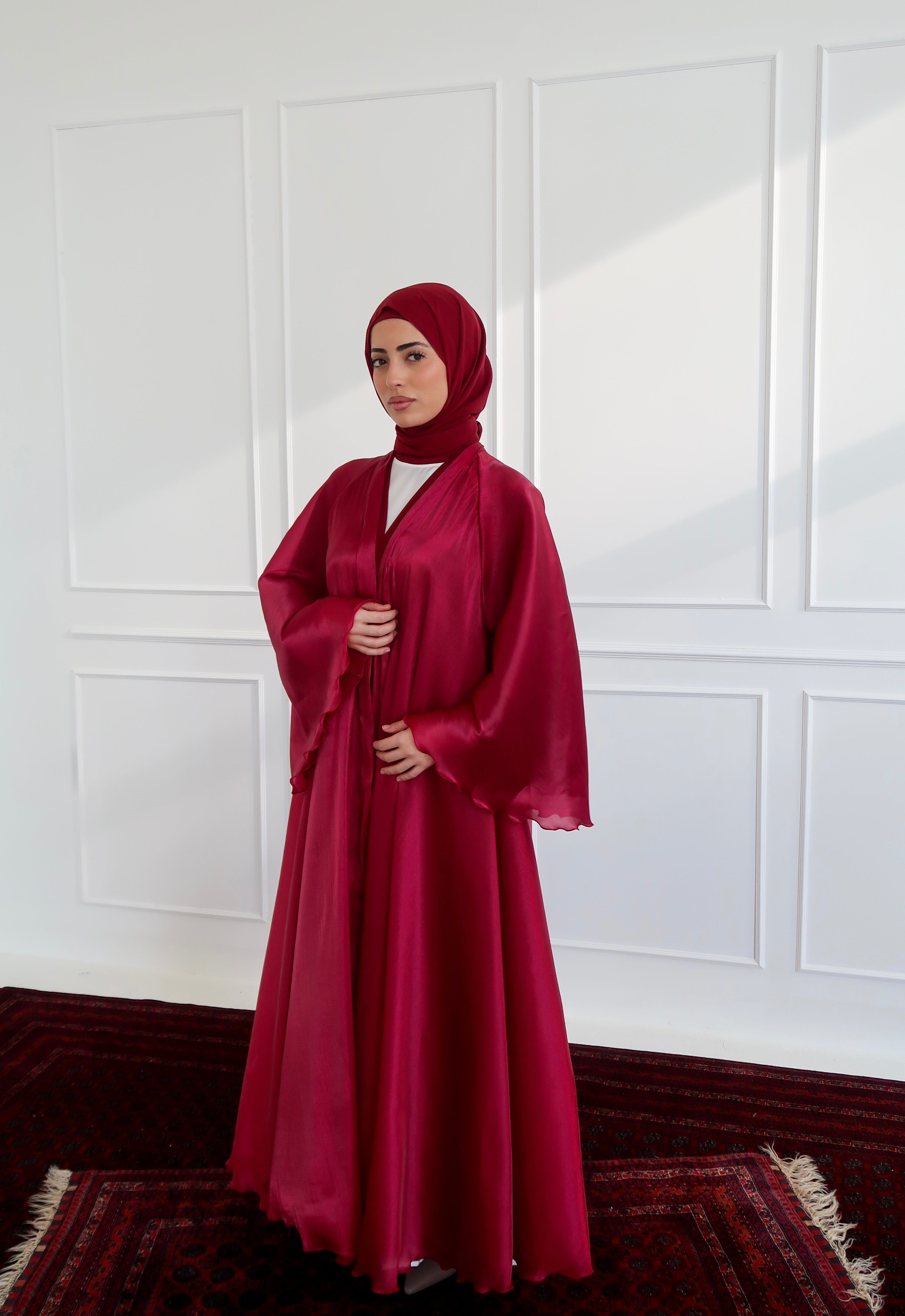 red abaya dress Pink crpe abaya paired with a red taffeta cape
